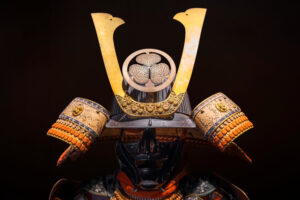 A samurai armor emerging from the shadows